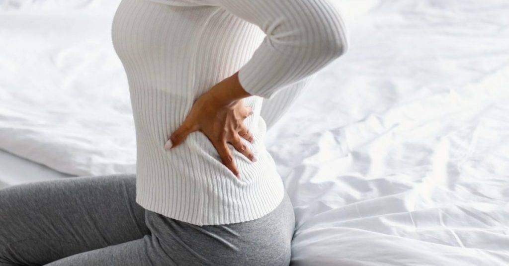 Donna con Sciatica